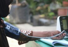 생활습관개선을 통한 심혈관 질환 개선 woman in brown and white leopard print bikini bottom holding blue and white plastic bottle