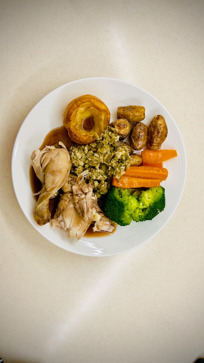 Photo by Sue Winston A white plate topped with different types of food
