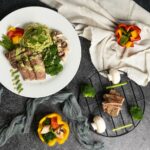 ‘균형 잡힌 식단’이 열풍… 나에게 맞게 실천하는 새로운 식탁 문화 a white plate topped with meat and veggies
